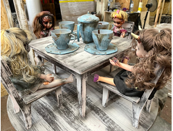 Table with dolls