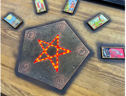 Table with pentagram and cards