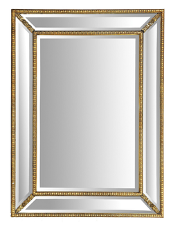 Зеркало в золотой классической раме с цветочным орнаментом.