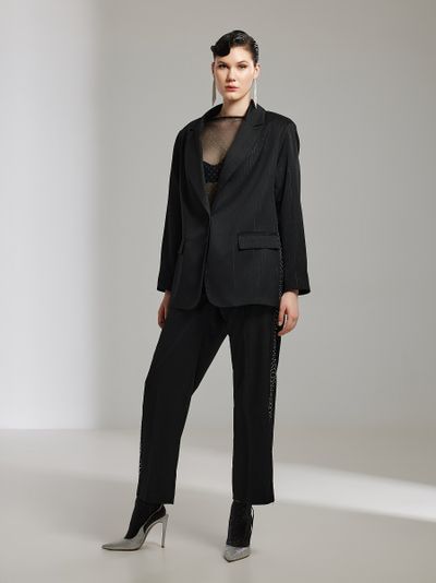 Женские нарядные брюки декорированные стразами