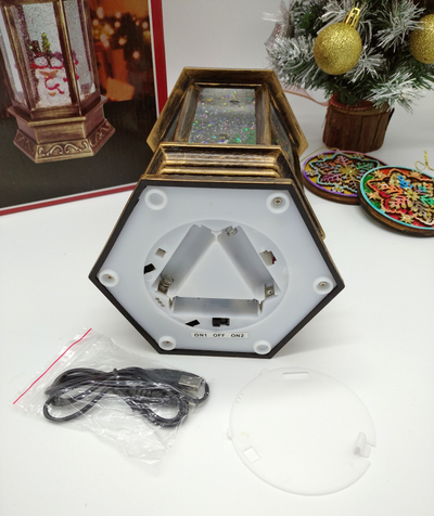 Музыкальный шестигранный фонарь со снегом и USB кабелем "Дед Мороз в санях с подарками", 30х14х14см