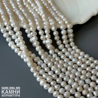 Жемчуг речной белый кругло-овальный фри-форм 5,7-6х6,5-8 мм, цена за нить 17 см