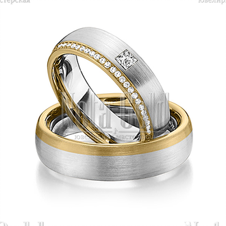 Обручальные кольца из белого и жёлтого золота с дорожкой бриллиантов и крупным бриллиантом в женском