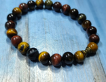 Браслет тигровый ,бычий ,соколиный глаз 8 мм