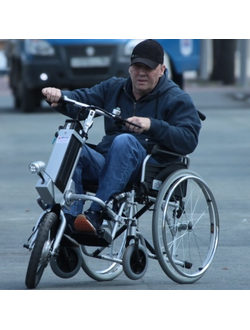 Электрическая приставка к инвалидному креслу