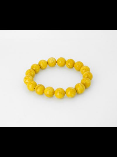 Браслет шары из состаренного янтаря на резинке