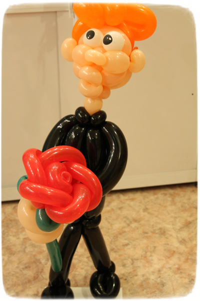 №104 Фигура человечек с цветком .Высота~70 см.