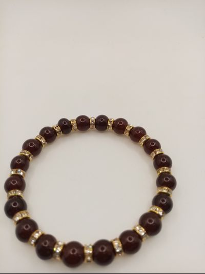 Браслет янтарь шары со стразами.