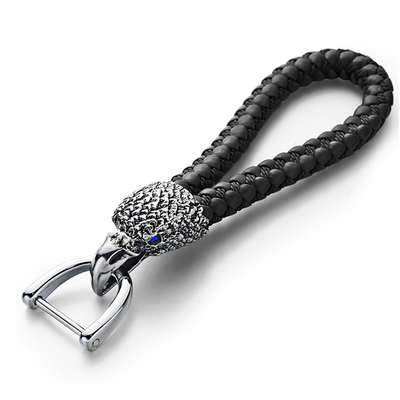 БРЕЛОК С КОЖАНЫМ ПЛЕТЁНЫМ РЕМЕШКОМ «ГОЛОВА ОРЛА»