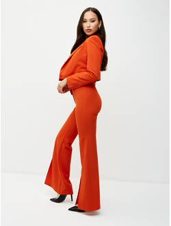 Брюки клеш от колена. Оранжевый