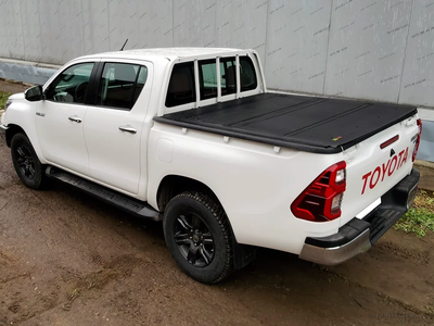 Жесткая 4-секц. алюм. крышка кузова HAL на Toyota Hilux араб под штатную решетку и вкладыш на борта