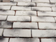 Декоративный облицовочный камень под кирпич Kamastone Петровский 3881, белый с черным и серым