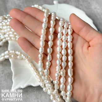 Жемчуг речной белый рис фри-форм крупный 9-13х7-8,5 мм с бороздками щербатый, цена за нить 17-18 см