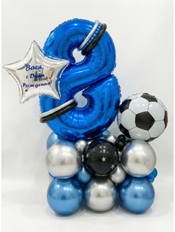 Цифра на подставке из шаров с футбольным мячом