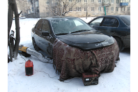 Процесс отогрева легкового автомобиля, г. Новокузнецк. Отогрев дизельной пушкой