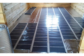 Монтаж инфракрасного теплого пола в коттедже