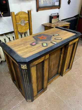 Table with pentagram and cards