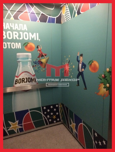 Брендирование лифтов в БЦ пленкой с полноцветной интерьерной печатью