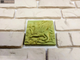 Декор-изразец к плитке под кирпич Kamastone Сказка 3071, мятно-зеленый с золотом
