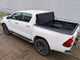 Жесткая 4-секц. алюм. крышка кузова HAL на Toyota Hilux араб под штатную решетку и вкладыш на борта