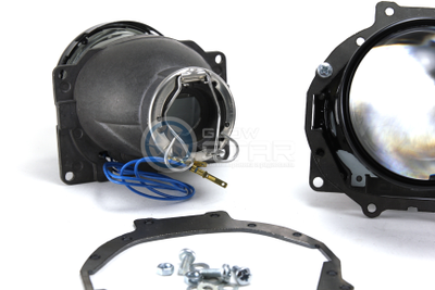 Комплект Hella R New с рамками для замены штатных ксеноновых / галогенных линз автомобиля Mitsubishi Pajero 4 (2006 - 2014)