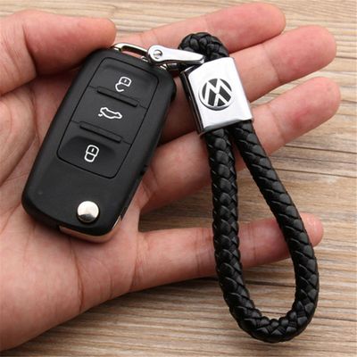 БРЕЛОК С КОЖАНЫМ ПЛЕТЁНЫМ РЕМЕШКОМ С ЛОГОТИПОМ АВТО ЧЁРНЫЙ