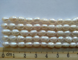 жемчуг рис №8-1.  (7×5,3мм).  Нить 17,5 см