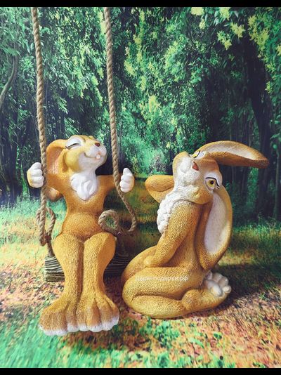 ЗАЙЧИХА МОДНИЦА  НА КАЧЕЛЯХ 28*18см   1,4кг   полистоун Россия 1649-012134   Заяц считается символом живительной силы, плодородия и жизненной энергии.