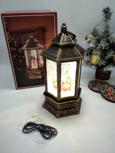 Музыкальный шестигранный фонарь со снегом и USB кабелем "Дед Мороз в санях с подарками", 30х14х14см