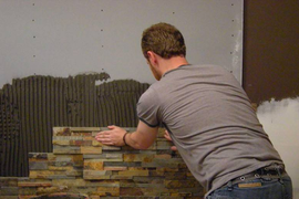 Укладка искусственного камня на стены