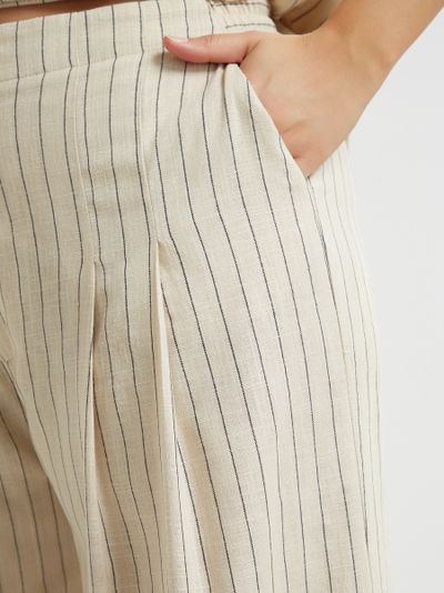 Брюки молочного цвета в полоску