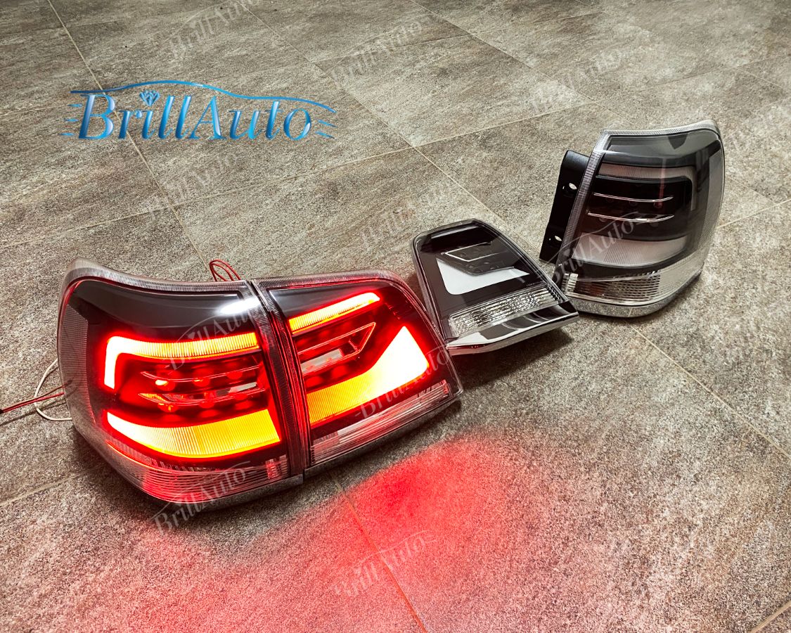 Cтопы Toyota Land Cruiser 200 07-15 в стиле 21 года LED (дымчатые серые)