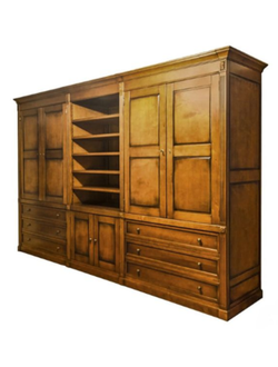 Шкаф для книг с центральной нишей и нижними ящиками.