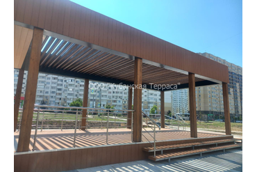 Коммерческое помещение полностью "ПОД КЛЮЧ" в г.Анапа размером 5*20 метров. Металлический каркас, деревянные балки с подсветкой. Пол, торец и кровля из полнотелой ДПК.