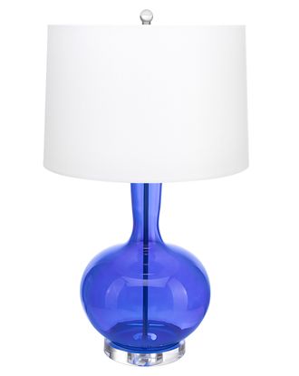 Настольная лампа из синего прозрачного стекла и белого абажура.