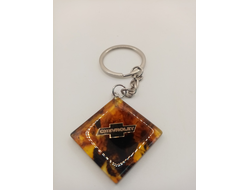 Брелок из натурального янтаря "Chevrolet"