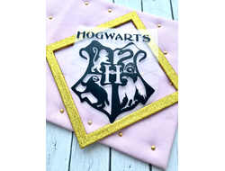 Надпись и эмблема из термотрансиферной плёнки "Hogwarts. Цвет чёрный.