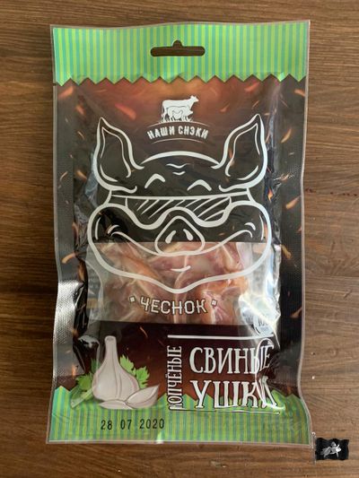 Ушки свиные ТМ Наши Снеки "ЧЕСНОК" 100 гр. в/к - г/в