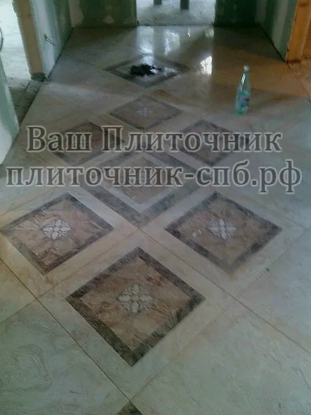 Коттеджный поселок под Парголово. Укладка керамогранита на пол по дизайнерским эскизам.