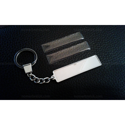 КОМПЛЕКТ 100 ШТ.: БРЕЛОК ГОС. НОМЕР АВТО. С БОРТИКАМИ «УСИЛЕННОЕ КРЕПЛЕНИЕ» — СЕРЕБРО. 50,9*10,6 мм.