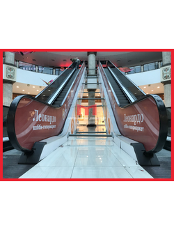 Оклейка эскалатора сеткой с печатью