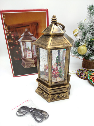 Музыкальный шестигранный фонарь со снегом и USB кабелем "Дед Мороз в санях с подарками", 30х14х14см