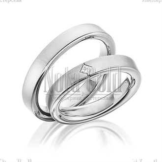 Классические обручальные кольца из белого золота с ромбическим бриллиантом в женском кольце прямоуго