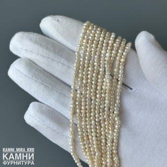 Жемчуг речной белый мелкий 1,6-1,8х2-2,8 мм, цена за нить 18 см