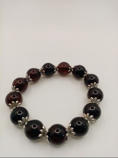 Браслет янтарь шары со вставками.