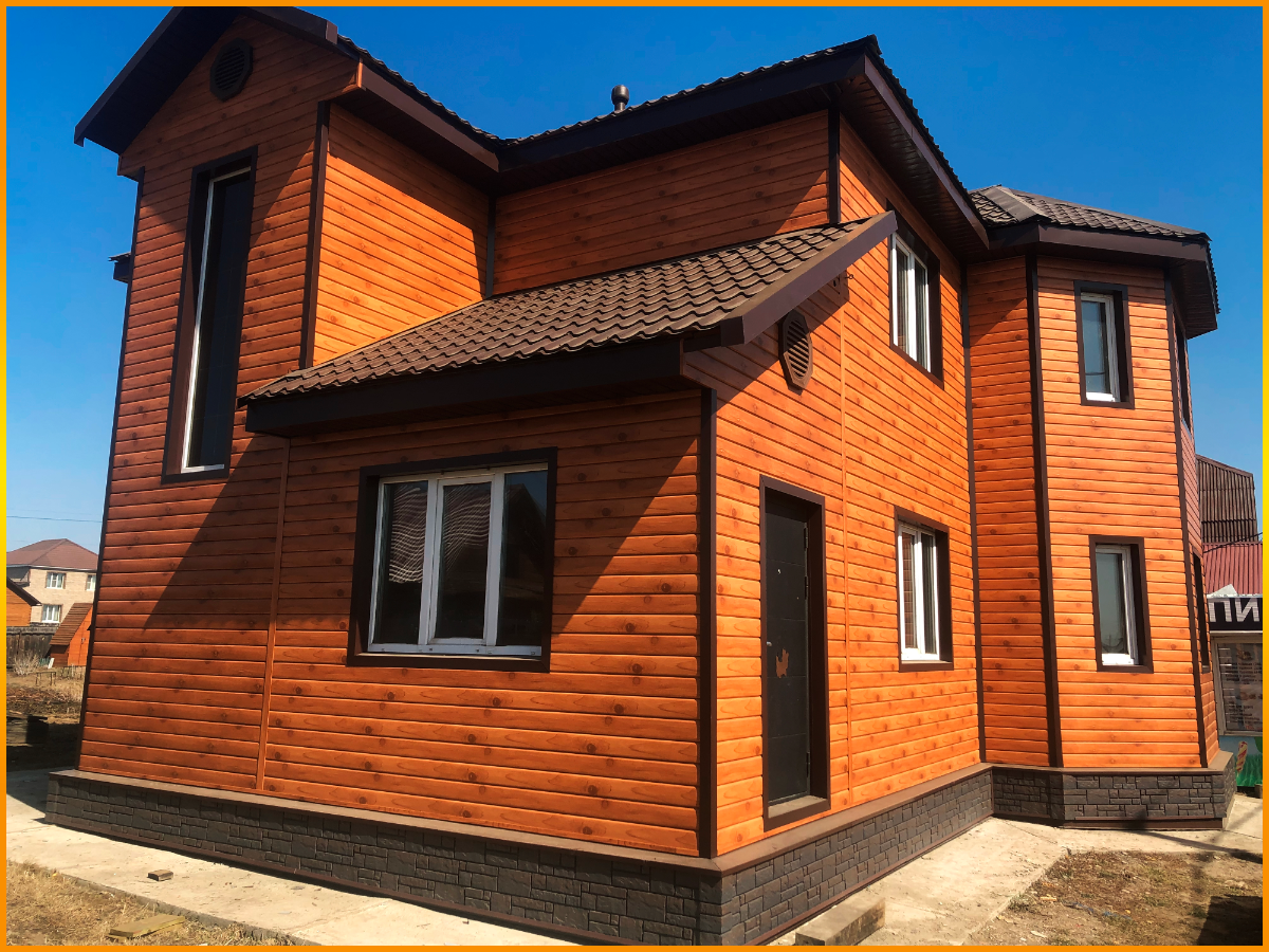 Дом обшитый сайдингом под дерево с утеплением