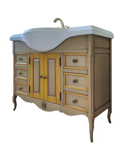 Тумба под накладную раковину на резных ножках.