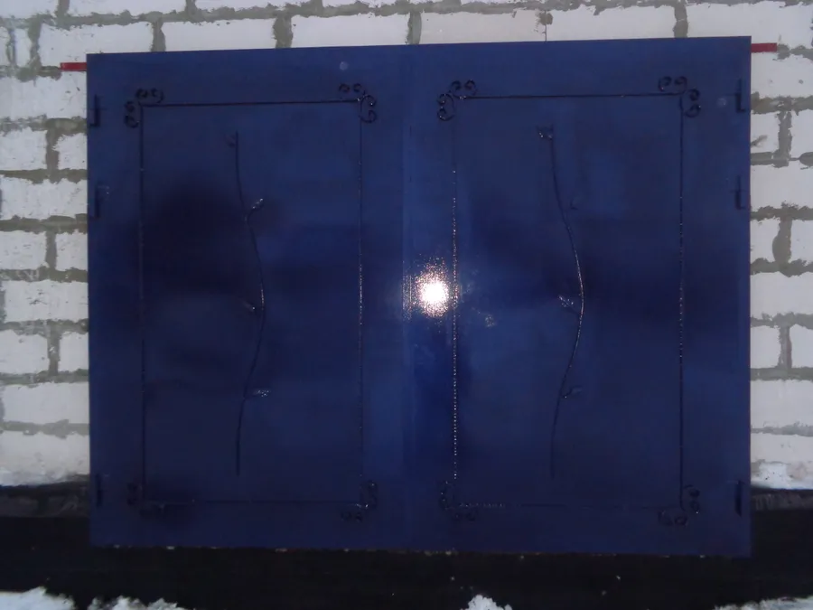 утепленные ворота с ковкой