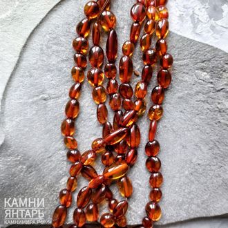 Янтарь коньячный фри-форм олива, средняя 11-16 мм, цена за нить 20 см
