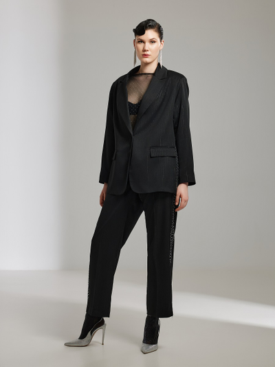 Женские нарядные брюки декорированные стразами